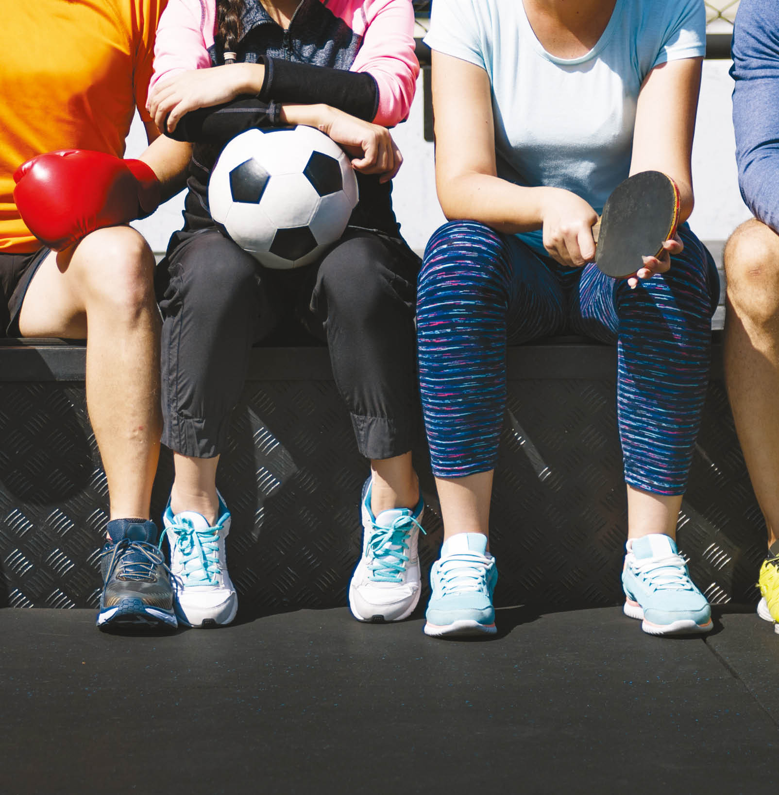 Group of diverse athletes sitting together
