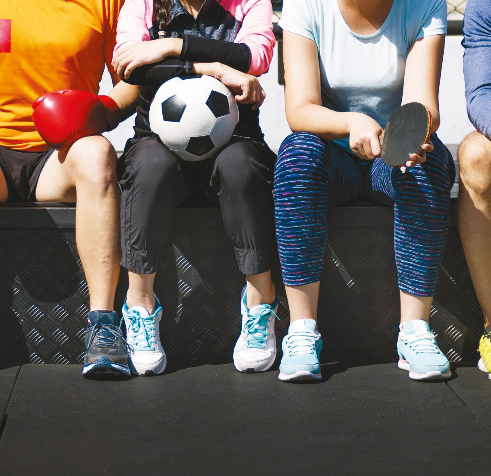 Group of diverse athletes sitting together